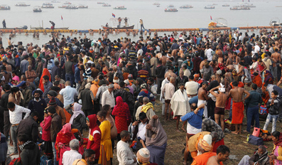 Hindu devotees crowd the Sangam